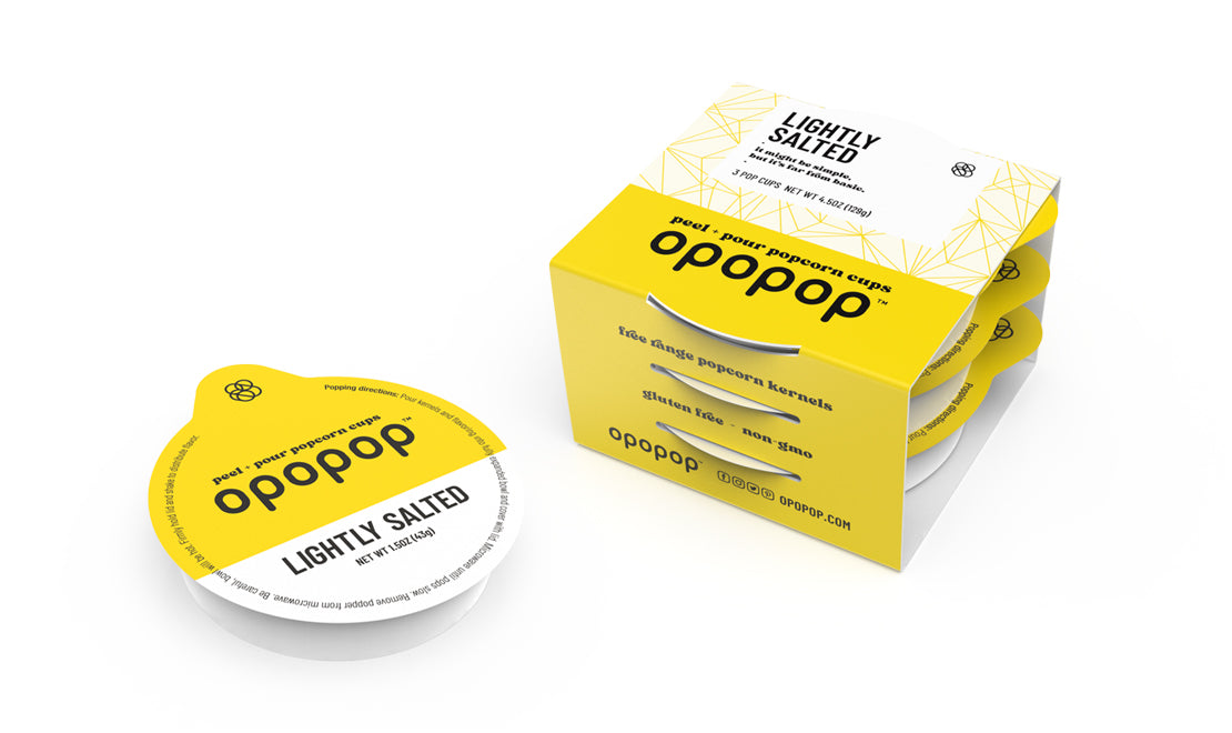 A single green leaf against a white background.